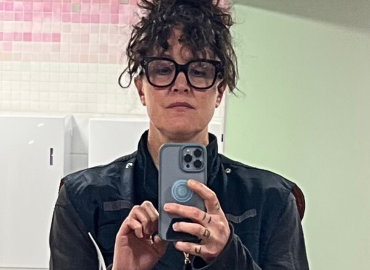 T.L. Cowan poses for a selfie in a bathroom mirror